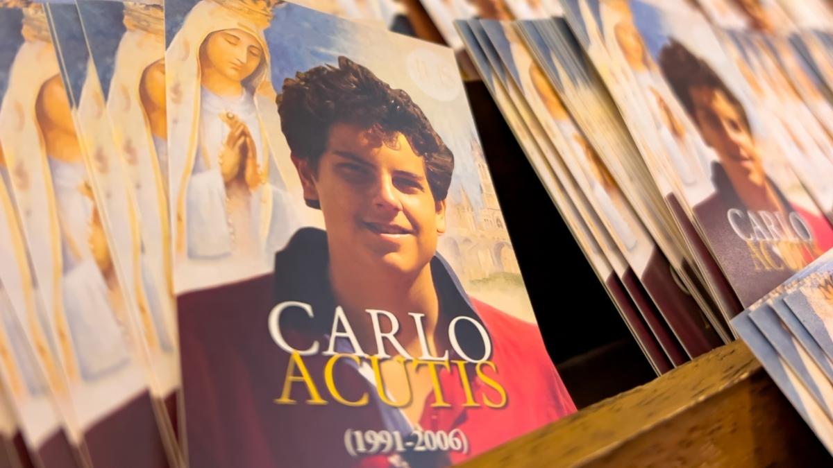 Assisi, Italy - September 9, 2023: Little posters of Carlo Acutis with the prayer to him on the back side
