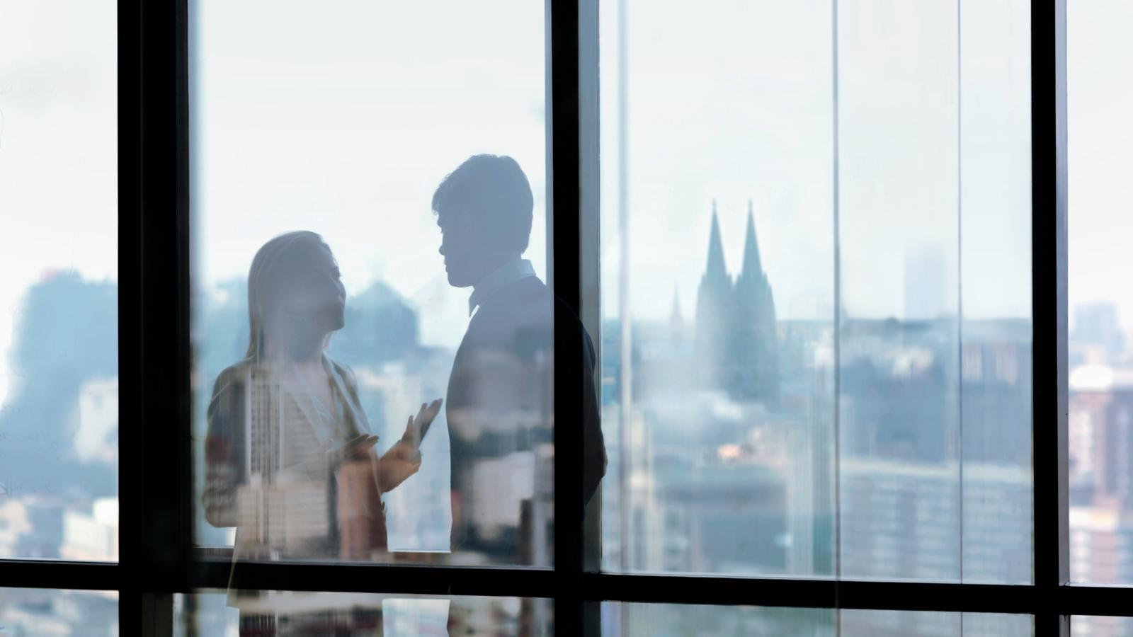 Silhouette shadows of business people talking in office